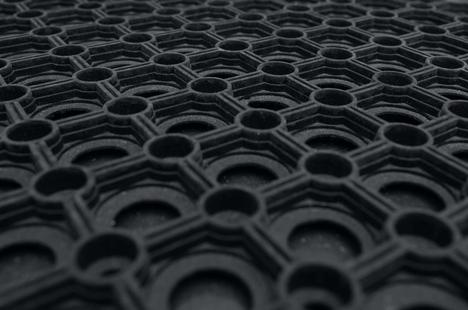 A close-up of a black rubber carpet